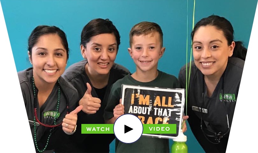 wow smiles staff and young boy smiling